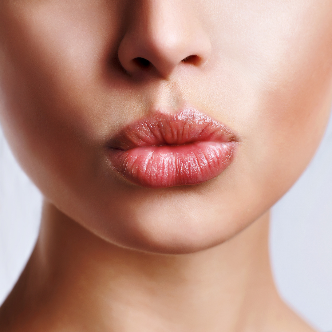 Lower half of woman's face with lips pouted